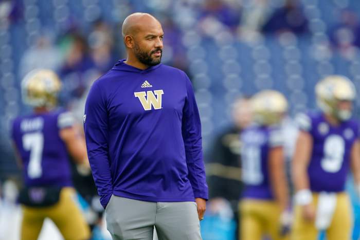 Oct 16, 2021; Seattle, Washington, USA; Washington Huskies head coach Jimmy Lake watches pregame warmups against the UCLA Bruins at Alaska Airlines Field at Husky Stadium.